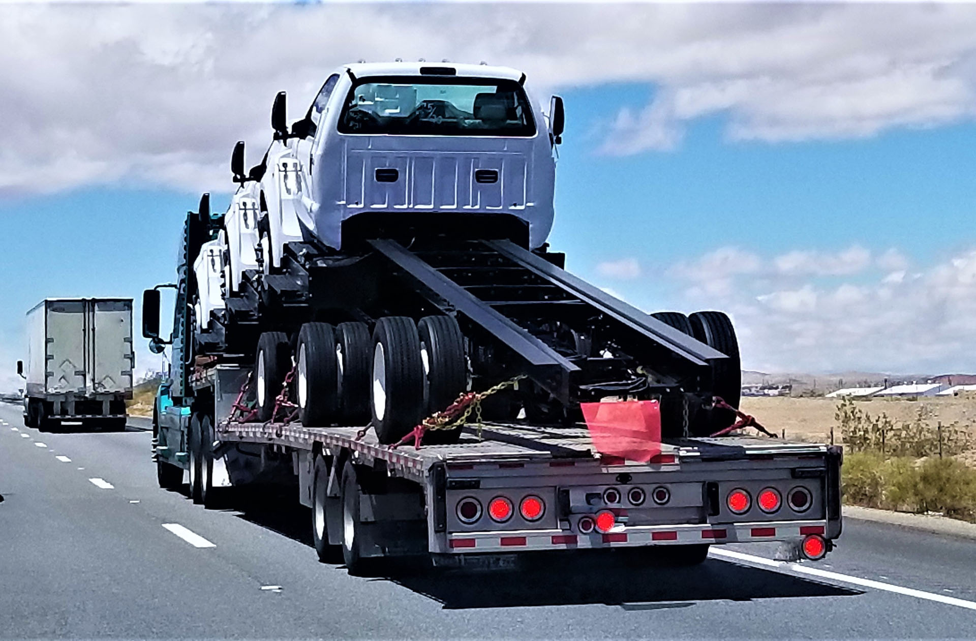 transportationand-logistics-big-rigs-on-a-flat-b-2022-11-08-05-25-19-utc